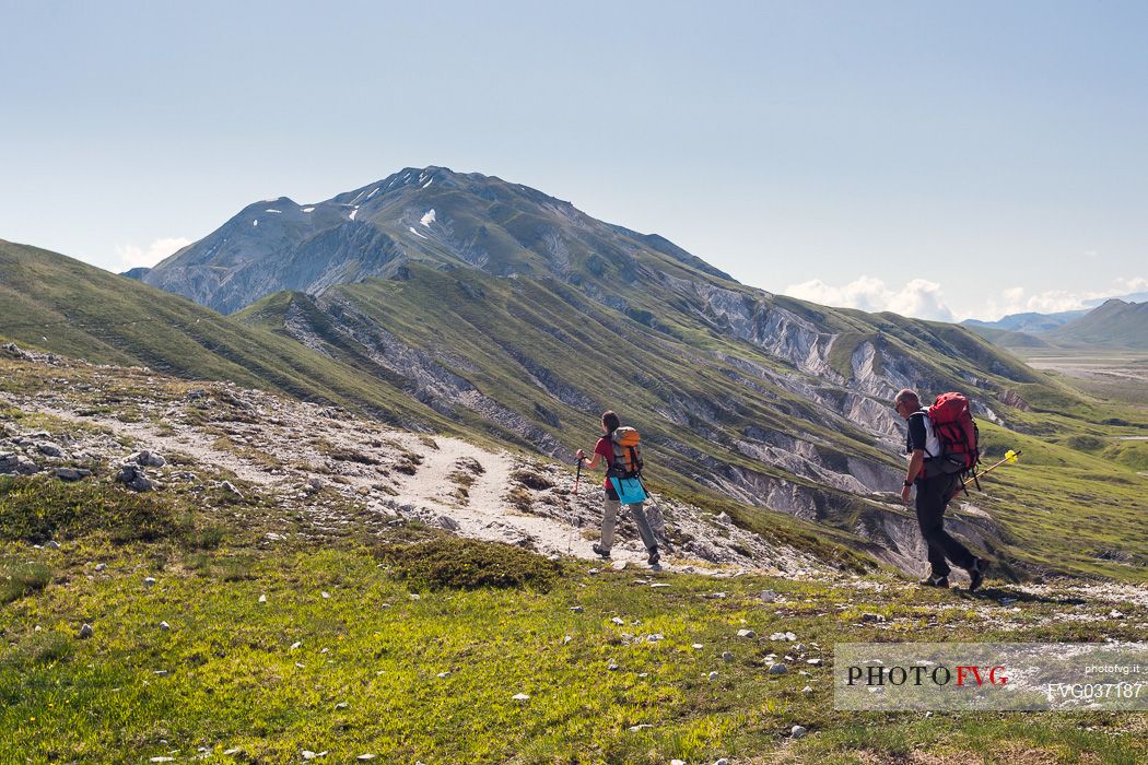 Hikers in the path to Camicia mount, Gran Sasso national park, Abruzzo, Italy, Europe