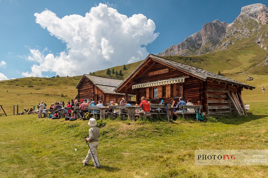 Tourists at Utia Vaciara hut, Badia valley, dolomites, South Tyrol, Italy, Europe