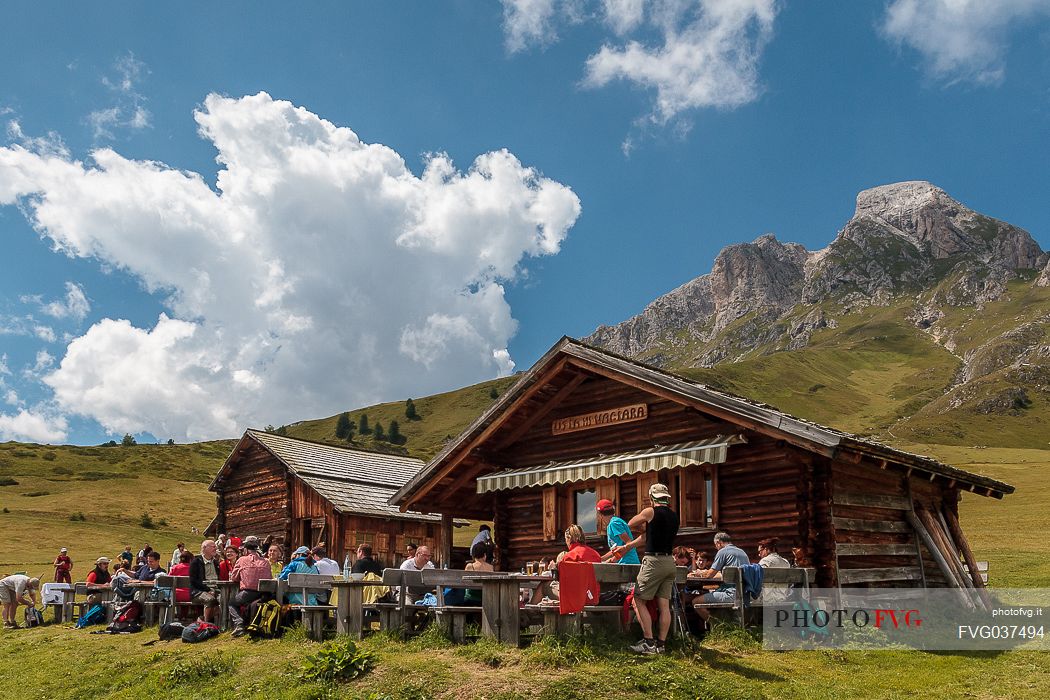 Tourists at Utia Vaciara hut, Badia valley, dolomites, South Tyrol, Italy, Europe