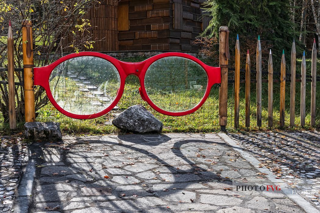 Unusual gate in Book house of Tambre, Cansiglio, Veneto, Italy, Europe