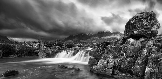 Sligachan waterfalls and the black cuillins in the background Sligachan waterfalls and the black cuillins in the background