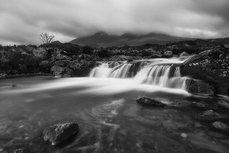 Sligachan waterfalls and the black cuillins in the background Sligachan waterfalls and the black cuillins in the background