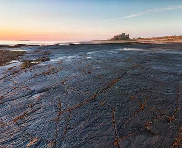 Bamburgh castle at dawn