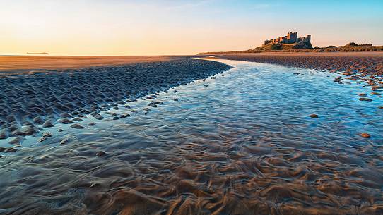 Bamburgh castle at dawn