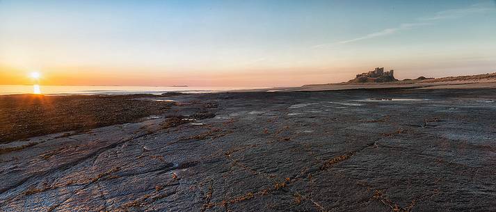 Bamburgh castle at dawn