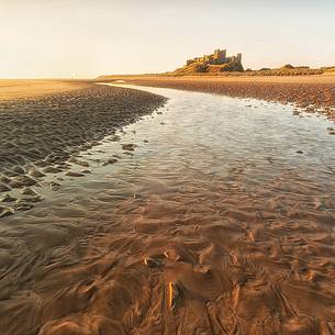 Bamburgh castle at dawn