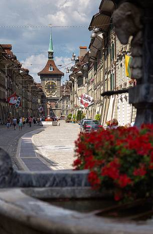Kramgasse street in the old city of Bern and in the background the Clock tower or Zytglogge clock, Unesco World Heritage, Switzerland, Europe