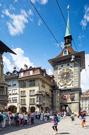 Tourists admiring the Clock tower or Zytglogge clock in the Kramgasse street, downtown of Bern, Unesco World Heritage, Switzerland, Europe