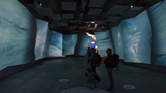 Tourist visiting the museum on the top of Jungfraujoch, the highest railway station in the Alps, Aletsch glacier, Bernese alps, Switzerland, Europe