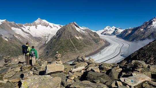 Mother and son at the Eggishorn mountain admiring the Aletsch glacier and Jungfrau mountains, Valais, Switzerland, Europe