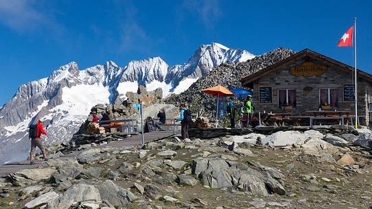 Hikers at the Horli Hitta mountain hut over Aletsch glacier, Eggishorn mountain, Fiesch,  Valais, Switzerland, Europe