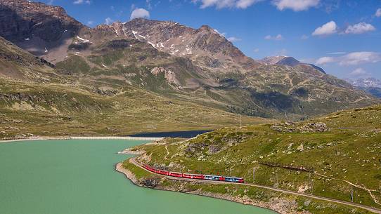 Rhaetian railway, Route from St. Moritz - Tirano, UNESCO World Heritage Site, at Bernina pass with Lago Bianco Lake, Engadin, Canton of Grisons, Switzerland, Europe