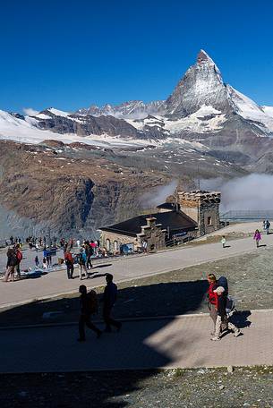 Summit station of Gornergrat railway and the Matterhorn or Cervino mount, Zermatt, Valais, Switzerland, Europe

