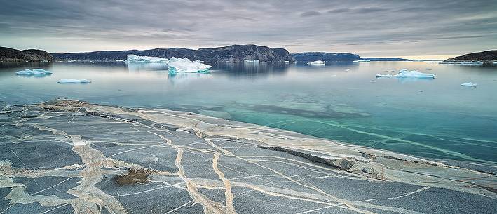 Reefs, sea with icebergs of Ataa a small village of
fishermen and seal hunters which was abandoned in the 50s