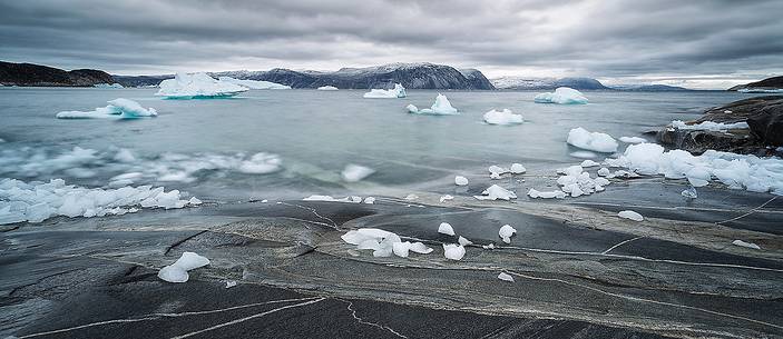 Reefs, sea with icebergs of Ataa a small village of
fishermen and seal hunters which was abandoned in the 50s