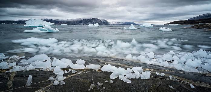 Reefs, sea with icebergs of Ataa a small village of
fishermen and seal hunters which was abandoned in the 50s