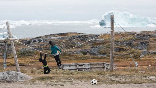 Children play in Rodebay a small village of fishermen and seal hunters in Disko Bay