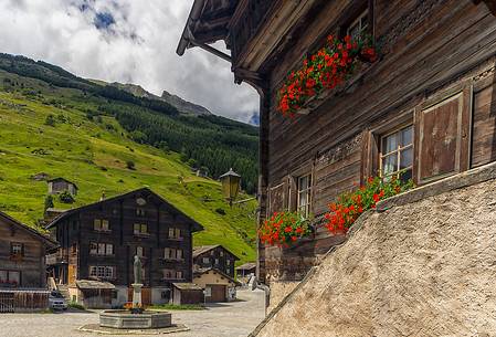 Traditional wooden buildings in Vals village and in the background the old square, Grisons, Switzerland, Europe