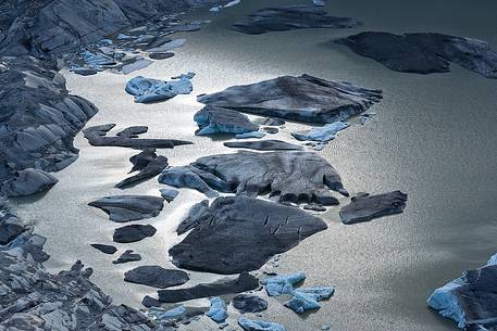 Iceberg on the little fusion lake on Rhone Glacier at Furka Pass, Canton of Valais, Switzerland, Europe