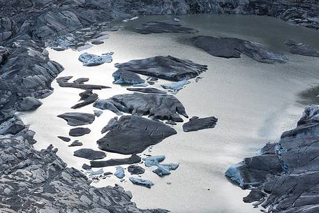 Iceberg on the little fusion lake on Rhone Glacier at Furka Pass, Canton of Valais, Switzerland, Europe