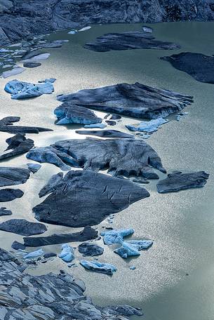 Iceberg on the little fusion lake on Rhone Glacier at Furka Pass, Canton of Valais, Switzerland, Europe