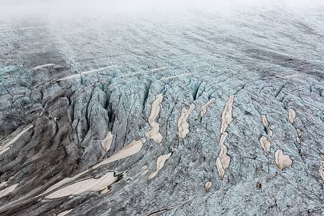 Mist and fog on Rhone Glacier at dawn, Furka pass, Valais, Switzerland, Europe