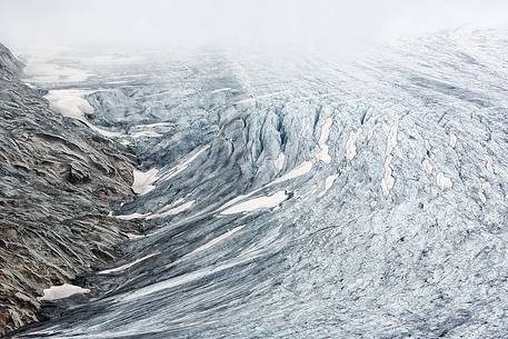 Mist and fog on Rhone Glacier at dawn, Furka pass, Valais, Switzerland, Europe