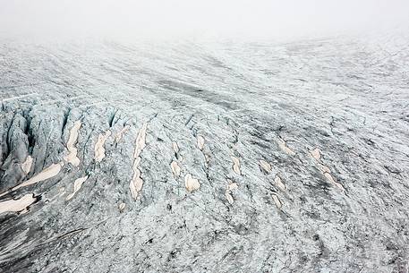 Mist and fog on Rhone Glacier at dawn, Furka pass, Valais, Switzerland, Europe