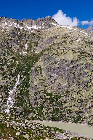 Grimselsee or Grisel lake and waterfall, Grimsel pass, Bernese alps, Switzerland, Europe Grimselsee or Grisel lake and waterfall, Grimsel pass, Bernese alps, Switzerland, Europe