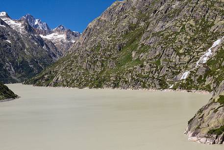Grimselsee or Grisel lake and waterfall, Grimsel pass, Bernese alps, Switzerland, Europe Grimselsee or Grisel lake and waterfall, Grimsel pass, Bernese alps, Switzerland, Europe