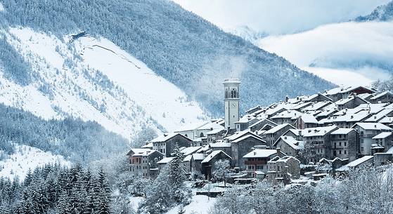 Alpine town of Erto after an intense snowfall, in the background the mont Toc after the disaster of Vajont Alpine town of Erto after an intense snowfall, in the background the mont Toc after the disaster of Vajont