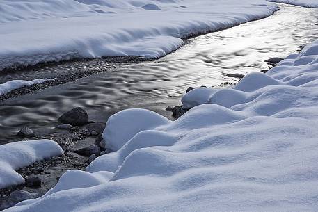 Sunrise in the alpine river Cellina