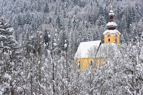 Alpine church in Fusine near the border with Austria and Slovenia after an heavy snowfall