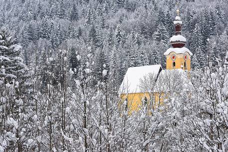 Alpine church in Fusine near the border with Austria and Slovenia after an heavy snowfall Alpine church in Fusine near the border with Austria and Slovenia after an heavy snowfall