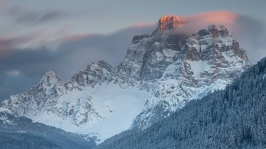 The Pelmo mountain at sunset after an intense snowfall