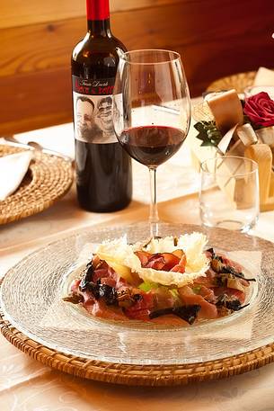 Elegant plate of cold meats and cheese served at the restaurant Morgenleit of Sauris di Sotto Elegant plate of cold meats and cheese served at the restaurant Morgenleit of Sauris di Sotto