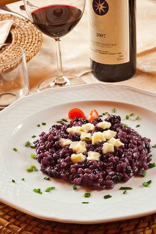 Orzotto with blueberries and alpine cheese, a typical plate of the restraunt Morgenleit in Sauris Orzotto with blueberries and alpine cheese, a typical plate of the restraunt Morgenleit in Sauris