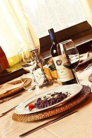 Orzotto with blueberries and alpine cheese, a typical plate of the restraunt Morgenleit in Sauris Orzotto with blueberries and alpine cheese, a typical plate of the restraunt Morgenleit in Sauris