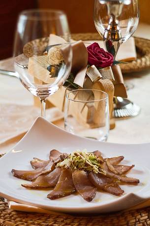 Elegant plate of cold meats served at the restaurant Morgenleit of Sauris di Sotto Elegant plate of cold meats served at the restaurant Morgenleit of Sauris di Sotto