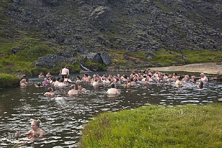 Group of people doing bath in one of the amazing natural thermal pool in Landmannalaugar Area Group of people doing bath in one of the amazing natural thermal pool in Landmannalaugar Area