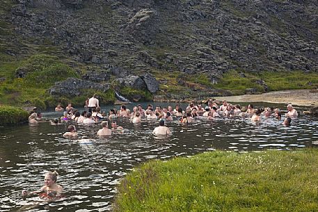 Group of people doing bath in one of the amazing natural thermal pool in Landmannalaugar Area