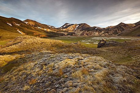 The multicoloured rhyolite mountains in the area of Landmannalaugar at sunrise The multicoloured rhyolite mountains in the area of Landmannalaugar at sunrise