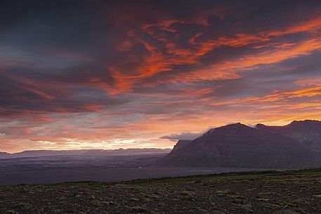 Amazing sunset over the desertic landscape of South Iceland from the mountain area of Skftafell