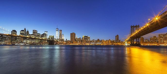 Manhattan skyline and Brooklyn  and Manhattan Bridge at evening