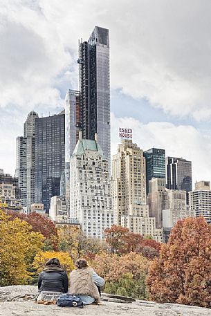 Two young girls admiring Wollman Rink and the Midtown skyline in the background 