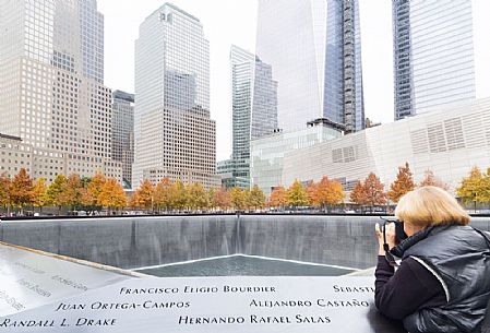 Woman shooting photos at Ground Zero memorial

