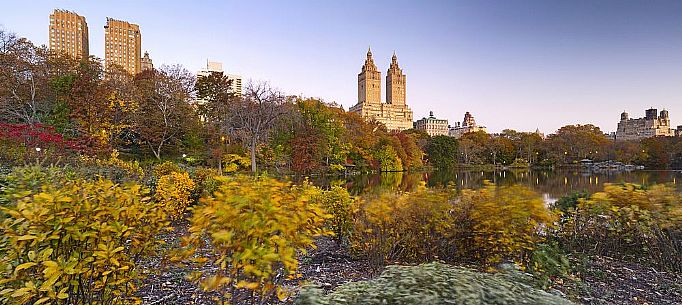 Central Park in autumn with the San Remo apartment building in the background Central Park in autumn with the San Remo apartment building in the background