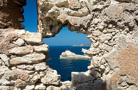 The lighthouse of Madonnetta from the ancient walls of Bonifacio The lighthouse of Madonnetta from the ancient walls of Bonifacio