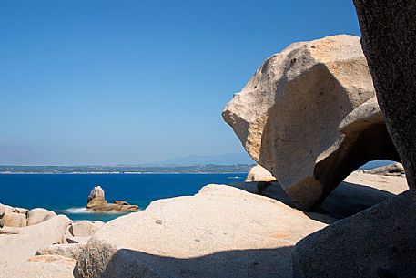 Stones in Lavezzi islands in natual reserve of Bocche di Bonifacio and in the background the island of Corsica