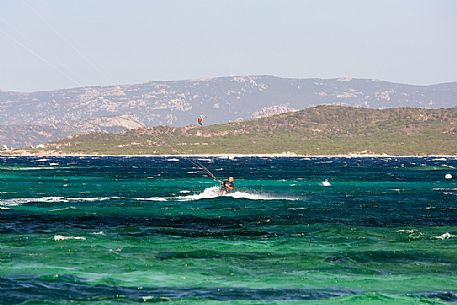 Kitesurf in the water of Tonnara beach, Corse, France, Europe Kitesurf in the water of Tonnara beach, Corse, France, Europe